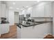 Bright kitchen featuring white cabinets, granite countertops, stainless steel appliances and a subway tile backsplash at 2656 Polo Club Blvd, Matthews, NC 28105