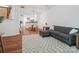 Hardwood floors in the bright living room with furniture and rug at 2656 Polo Club Blvd, Matthews, NC 28105