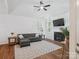 Cozy living room with hardwood floors, a fireplace, and natural lighting at 2656 Polo Club Blvd, Matthews, NC 28105