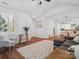 Hardwood floors in the bright living room with windows, furniture, and rug at 2656 Polo Club Blvd, Matthews, NC 28105