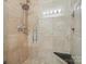 Tiled shower showcasing a rainfall shower head and stone bench at 2656 Polo Club Blvd, Matthews, NC 28105