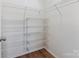 Spacious walk-in closet with modern shelving units, providing ample storage space at 2656 Polo Club Blvd, Matthews, NC 28105