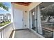 Outdoor balcony showcasing sliding glass doors and white railings at 3853 Carl Parmer Dr, Harrisburg, NC 28075
