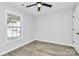 Bright bedroom with hardwood floors, ceiling fan, and a window with natural light at 3853 Carl Parmer Dr, Harrisburg, NC 28075