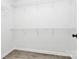 Bright, walk-in closet with white walls, trim, and shelving offers ample storage space at 3853 Carl Parmer Dr, Harrisburg, NC 28075