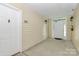 This is an entrance with two white doors and outdoor lighting at 3853 Carl Parmer Dr, Harrisburg, NC 28075
