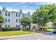 Desirable condo featuring dormer windows, lush landscaping, and inviting entrance at 3853 Carl Parmer Dr, Harrisburg, NC 28075