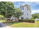 Well-maintained condo community with mature trees, manicured lawns, and charming exterior features at 3853 Carl Parmer Dr, Harrisburg, NC 28075