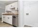 Bright kitchen featuring granite countertops, white cabinets, and stainless steel dishwasher at 3853 Carl Parmer Dr, Harrisburg, NC 28075
