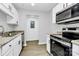 Well-lit kitchen featuring granite countertops, stainless steel appliances, and white cabinetry at 3853 Carl Parmer Dr, Harrisburg, NC 28075