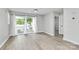 Bright living room with sliding glass doors and modern flooring at 3853 Carl Parmer Dr, Harrisburg, NC 28075