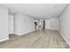 Spacious living area with ample natural light and modern flooring at 3853 Carl Parmer Dr, Harrisburg, NC 28075
