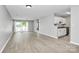 Open-concept living area with a sliding glass door and eat-in kitchen at 3853 Carl Parmer Dr, Harrisburg, NC 28075
