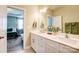 Elegant bathroom with double sinks, modern fixtures, and stylish decor with easy access to the main bedroom at 3925 Rothwood Ln, Harrisburg, NC 28075