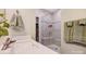 Modern bathroom featuring sleek sink, frameless shower, and fresh towels at 3925 Rothwood Ln, Harrisburg, NC 28075