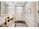 Bright foyer featuring decorative mirror, console table, and stylish accents at 3925 Rothwood Ln, Harrisburg, NC 28075
