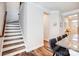 Hallway and Stairwell with hardwood floors, modern design, and natural light at 3925 Rothwood Ln, Harrisburg, NC 28075
