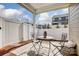 Charming outdoor patio with decorative table and chairs, and a white fence at 3925 Rothwood Ln, Harrisburg, NC 28075