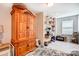 Bright storage room with shelves, a wooden cabinet, and white floors at 3925 Rothwood Ln, Harrisburg, NC 28075