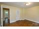Cozy bedroom with hardwood floors and neutral walls at 5008 Brooktree Dr, Charlotte, NC 28208