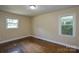 Charming bedroom with wood floors and two windows allowing plenty of sunlight at 5008 Brooktree Dr, Charlotte, NC 28208
