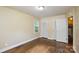 Bright bedroom with hardwood flooring, natural light, and closet space at 5008 Brooktree Dr, Charlotte, NC 28208