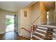 Interior entryway featuring hardwood floors, staircase, and natural light from the open door at 5008 Brooktree Dr, Charlotte, NC 28208
