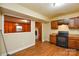 View from the kitchen into the living room with fireplace at 5008 Brooktree Dr, Charlotte, NC 28208