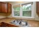 Classic kitchen featuring a double sink and window at 5008 Brooktree Dr, Charlotte, NC 28208