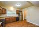Functional kitchen with wood cabinets and stainless steel refrigerator at 5008 Brooktree Dr, Charlotte, NC 28208