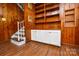 Charming living room with built in bookshelves and white storage at 5008 Brooktree Dr, Charlotte, NC 28208