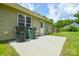 A concrete patio, adjacent to lawn and a light-colored home, awaits your outdoor gatherings and relaxation at 551 Sylvan Sw St, Concord, NC 28025