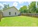 The property features a fenced-in backyard with a well-maintained lawn, perfect for outdoor enjoyment at 551 Sylvan Sw St, Concord, NC 28025