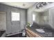 Bathroom with a sink, window and toilet at 551 Sylvan Sw St, Concord, NC 28025