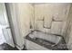 Bathroom featuring a bathtub with shower at 551 Sylvan Sw St, Concord, NC 28025