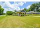 Charming one-story home with a well-maintained lawn, showcasing curb appeal at 551 Sylvan Sw St, Concord, NC 28025