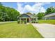 Charming one-story home with beautiful lawn and well-manicured landscaping at 551 Sylvan Sw St, Concord, NC 28025