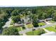 An aerial view of a home with a lake in the background, surrounded by lush greenery and trees at 622 S Carolina Ave, Statesville, NC 28677