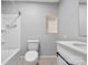 Modern bathroom with a vanity, toilet, and tiled shower-tub, creating a clean and functional space at 622 S Carolina Ave, Statesville, NC 28677