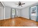 This bedroom features hardwood floors, two windows, and closet space with neutral paint at 622 S Carolina Ave, Statesville, NC 28677