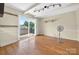 Bright dining room with hardwood floors and sliding glass door to backyard at 622 S Carolina Ave, Statesville, NC 28677