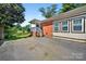 Charming brick home with lakeside views, inviting porch, and ample parking at 622 S Carolina Ave, Statesville, NC 28677