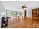 Spacious living room featuring hardwood floors, a fireplace, and sliding glass doors to a lake view at 622 S Carolina Ave, Statesville, NC 28677