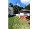 The well-maintained backyard features green grass and a white fence for a private outdoor space at 7333 Rosehall Dr, Charlotte, NC 28227