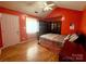 Spacious bedroom with wood floors and a cozy atmosphere at 7333 Rosehall Dr, Charlotte, NC 28227