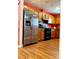 Kitchen with stainless steel refrigerator and ample wood cabinets at 7333 Rosehall Dr, Charlotte, NC 28227