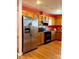 Kitchen featuring stainless steel refrigerator and wood cabinets at 7333 Rosehall Dr, Charlotte, NC 28227