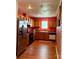 Kitchen featuring wood cabinets, tile backsplash, and stainless steel refrigerator at 7333 Rosehall Dr, Charlotte, NC 28227
