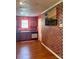 Kitchen featuring wood cabinets and tile backsplash at 7333 Rosehall Dr, Charlotte, NC 28227