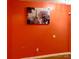 Bright orange wall with a picture featuring the Eiffel Tower at 7333 Rosehall Dr, Charlotte, NC 28227